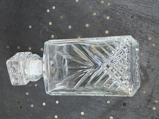 Ice bucket and whiskey decanter made of vintage chiseled transparent glass