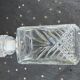 Ice bucket and whiskey decanter made of vintage chiseled transparent glass