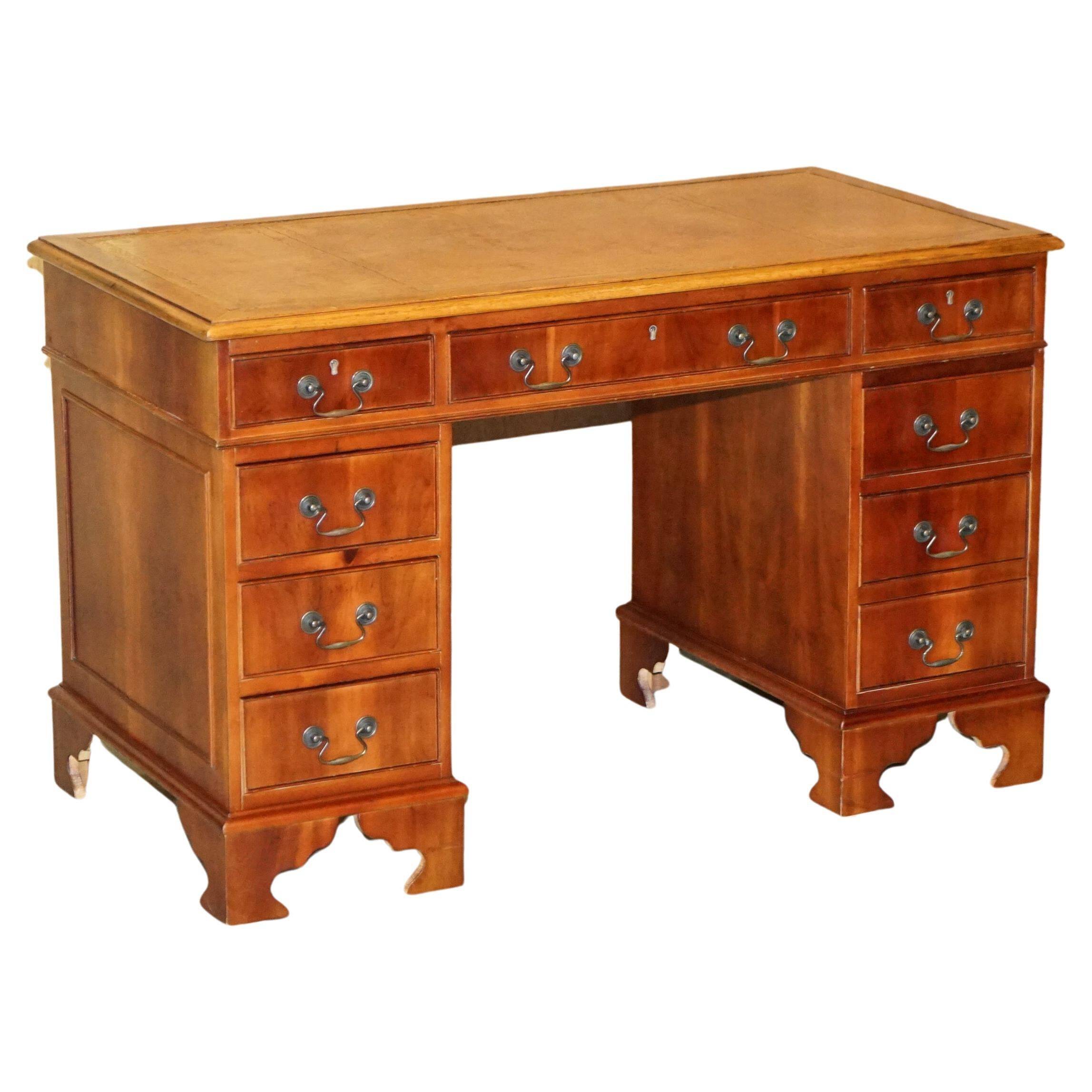 Vintage walnut desk with a leather top and two drawers.