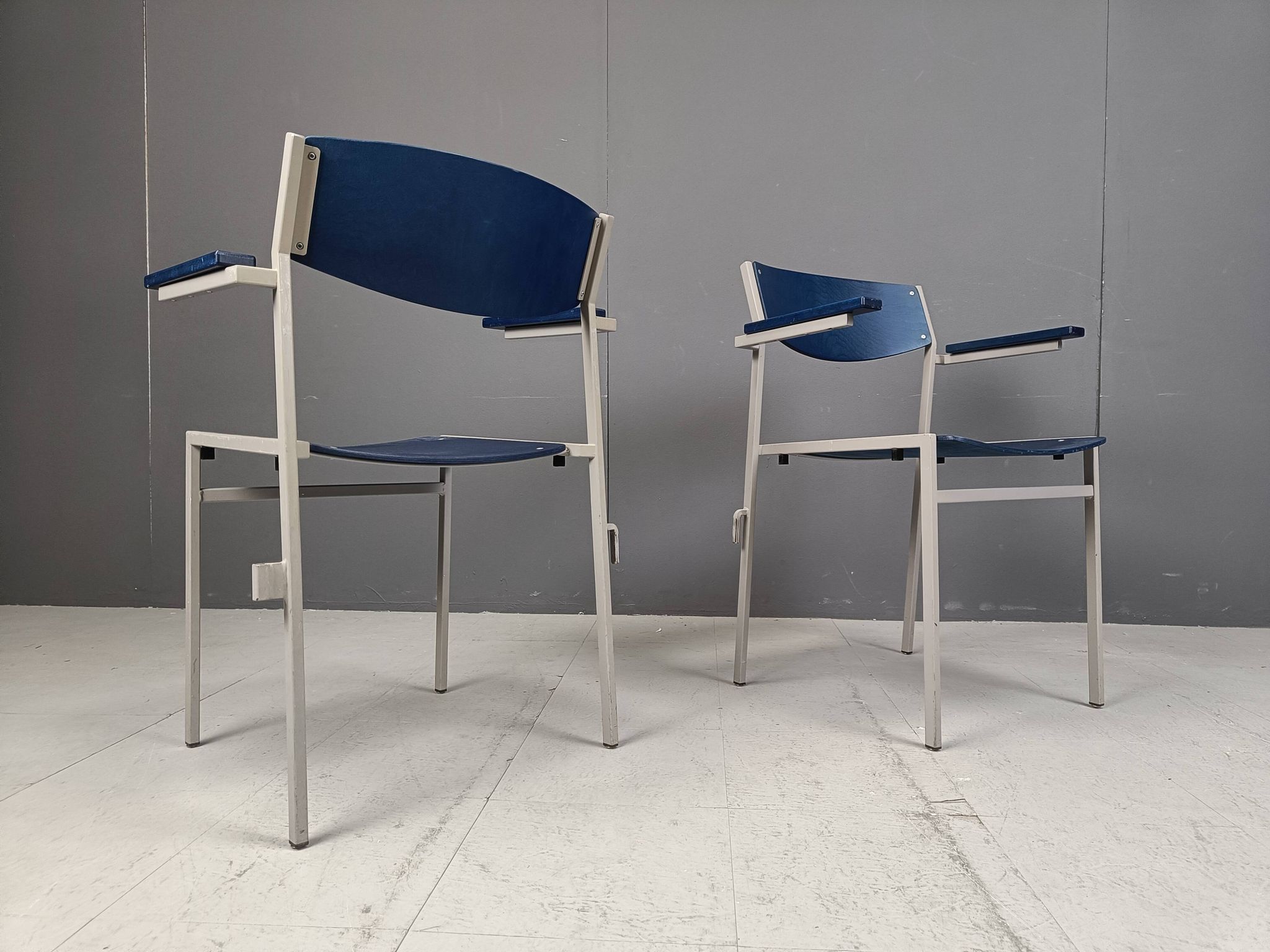 Minimalist metal and plywood stackable armchairs by Gijs Van Der Sluis