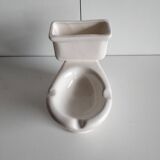 Atypical ashtray in the shape of a toilet