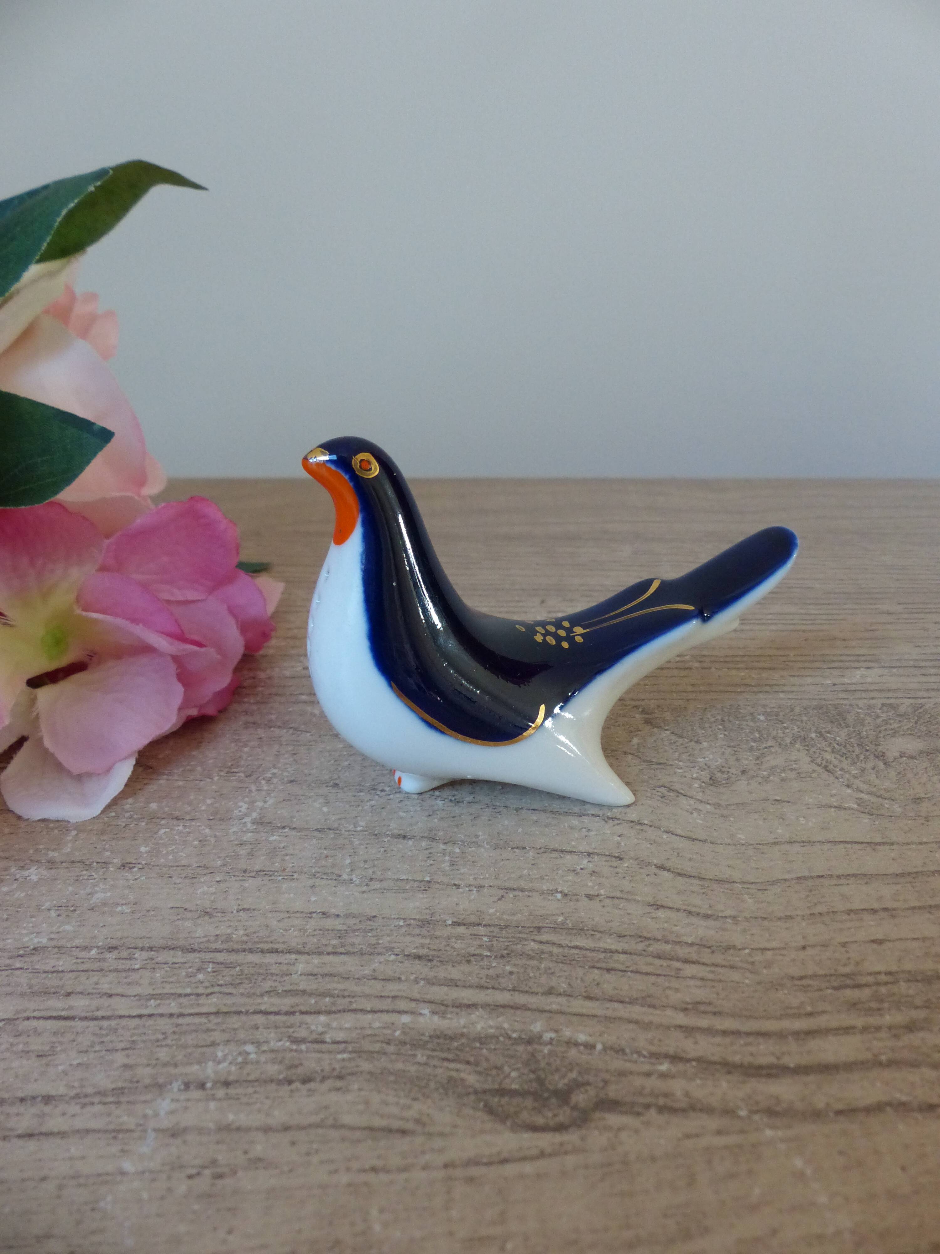 Vintage Soviet salt and pepper shaker in the shape of a cobalt blue bird.