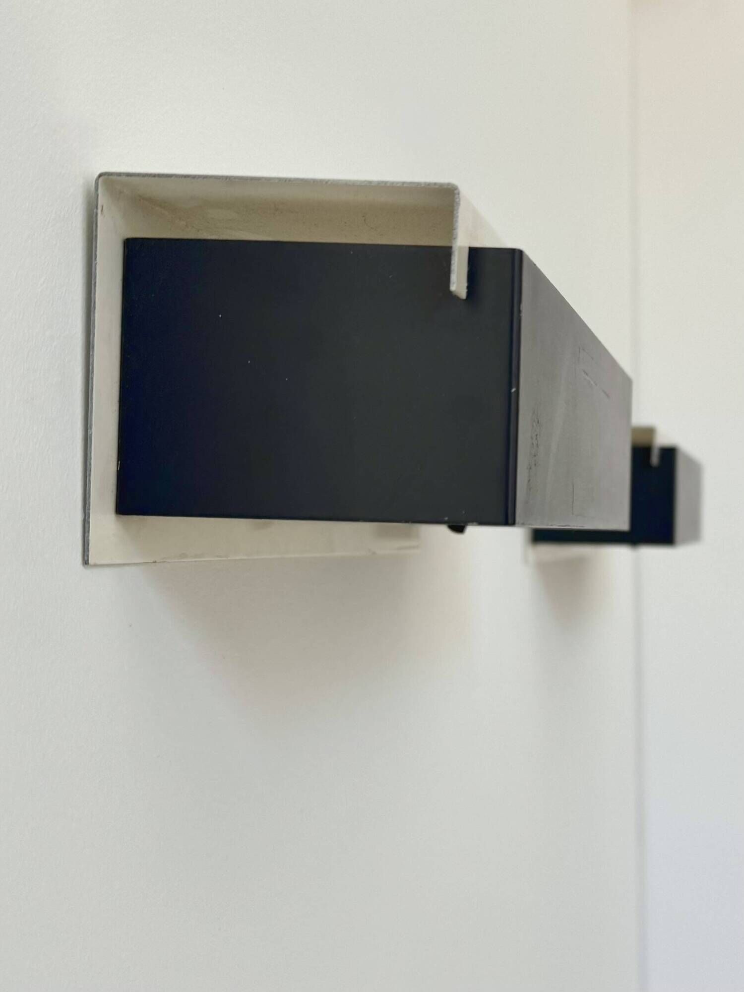 Pair of vintage wall sconces, painted black and white metal, Sweden 1970.