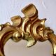 Large rococo mirror in gold painted wood