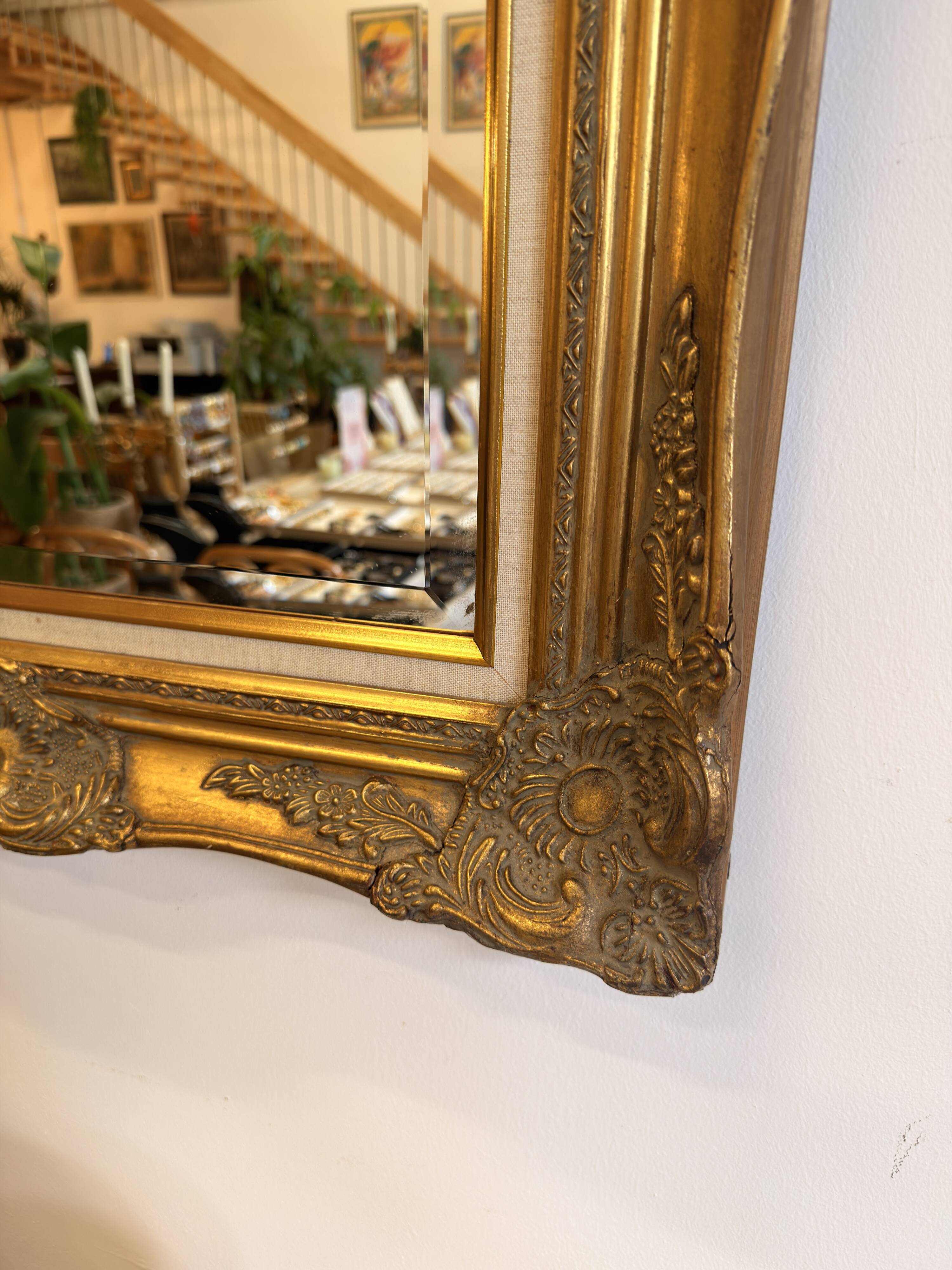 Golden wooden mirror in Louis XV style