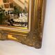 Golden wooden mirror in Louis XV style