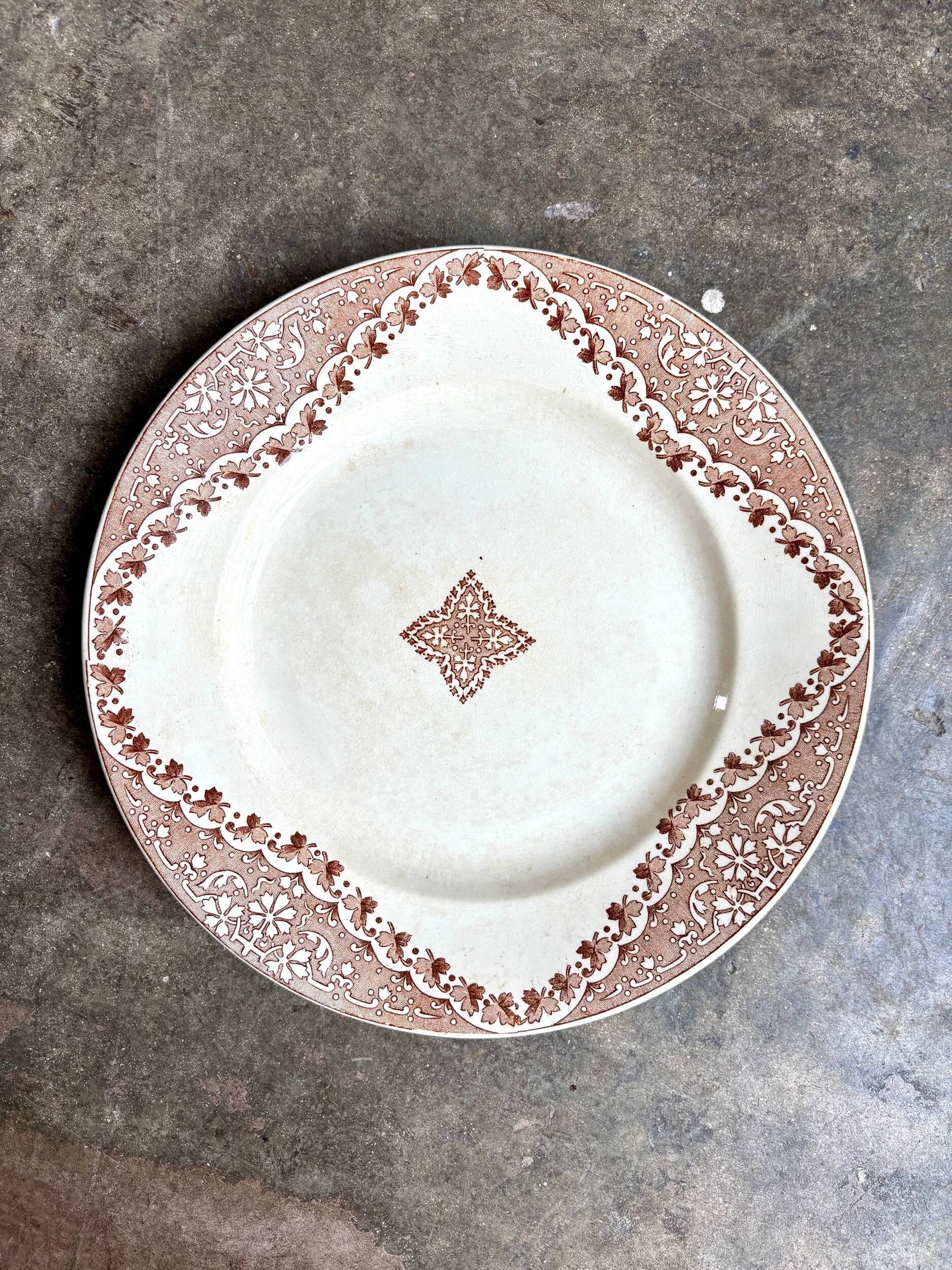 Longwy round dish in brown ironstone, "Andalous" service