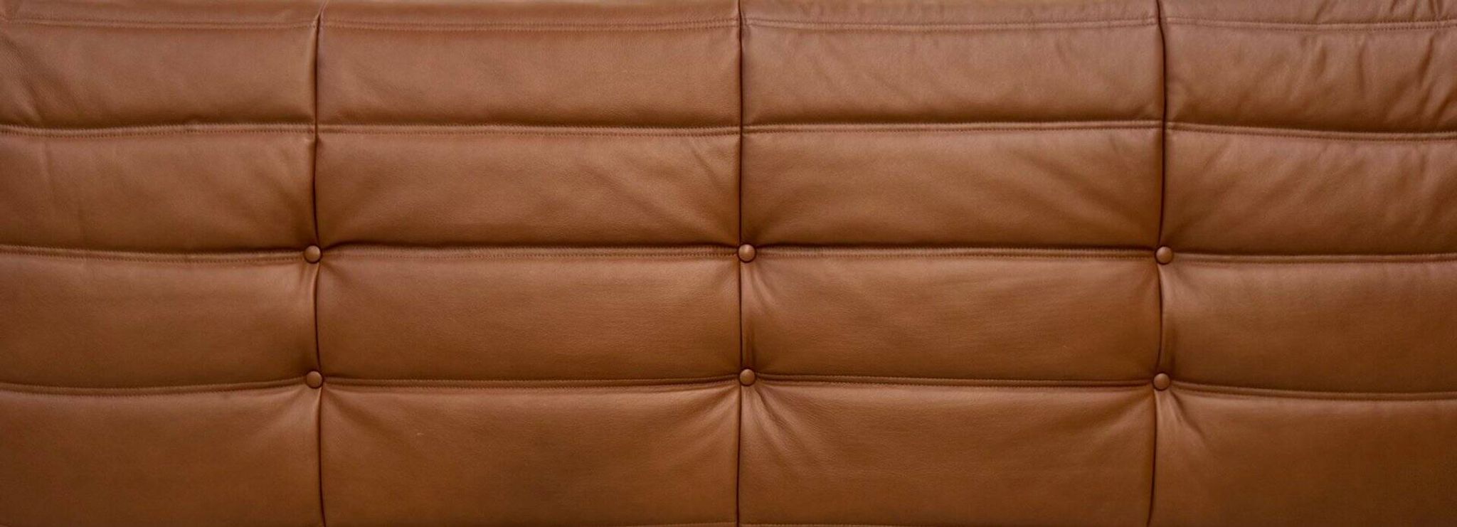 Three-seater Togo sofa in dark cognac leather by Michel Ducaroy for Ligne Roset.