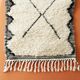 Berber carpet Béni Ouarain black and white with diamonds and braided border