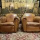 Pair of club armchairs in Havana leather 1950
