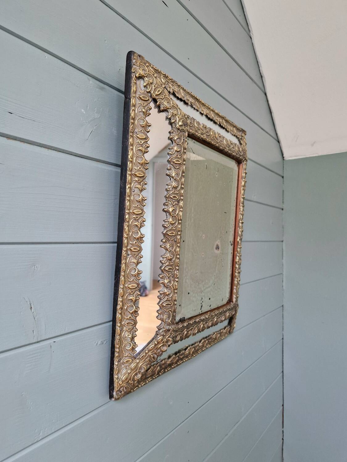 Mirror with embossed brass and mercury glass glazing beads, 19th century