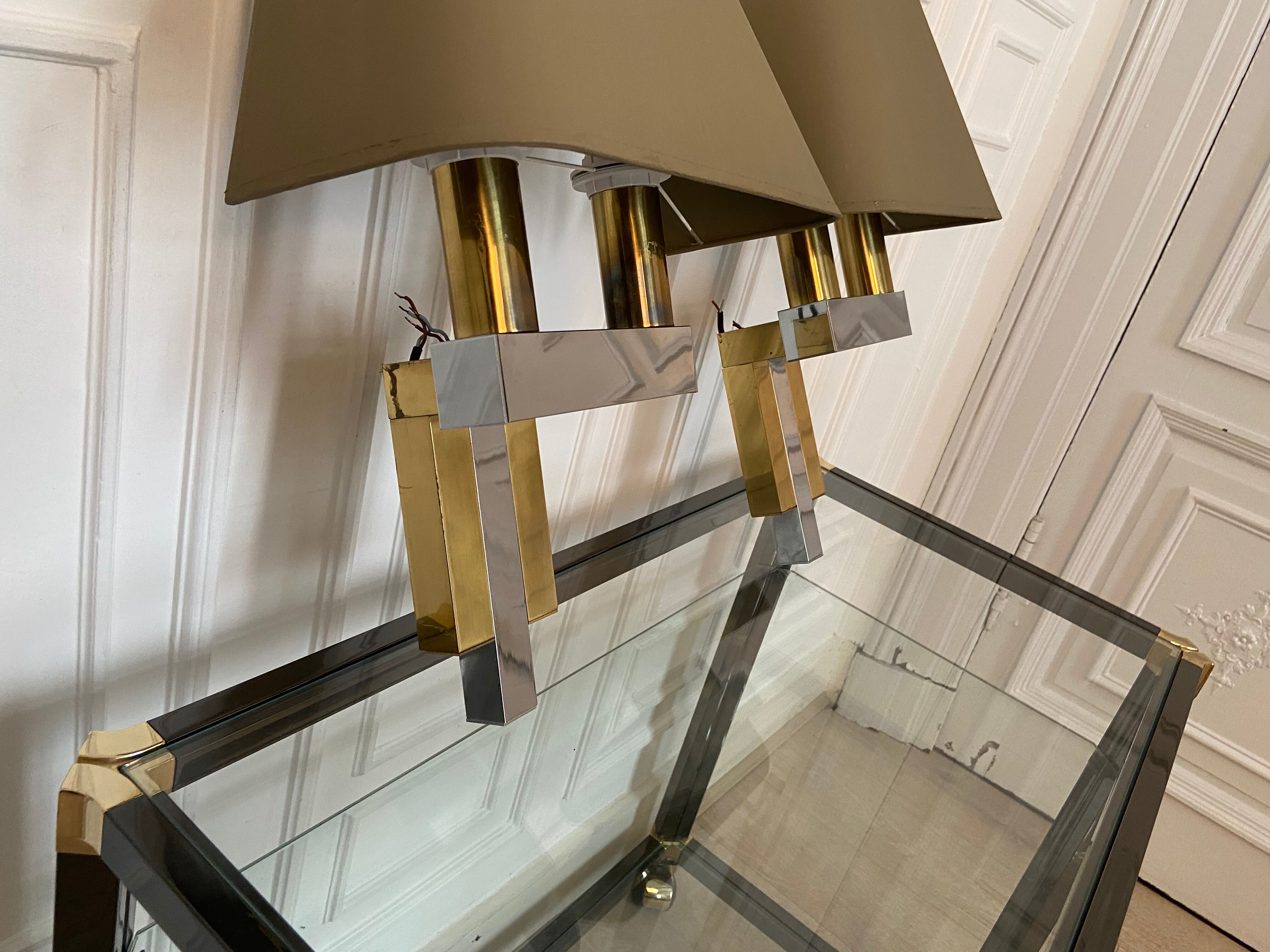 Pair of chrome and brass sconces, Italy, 1970s