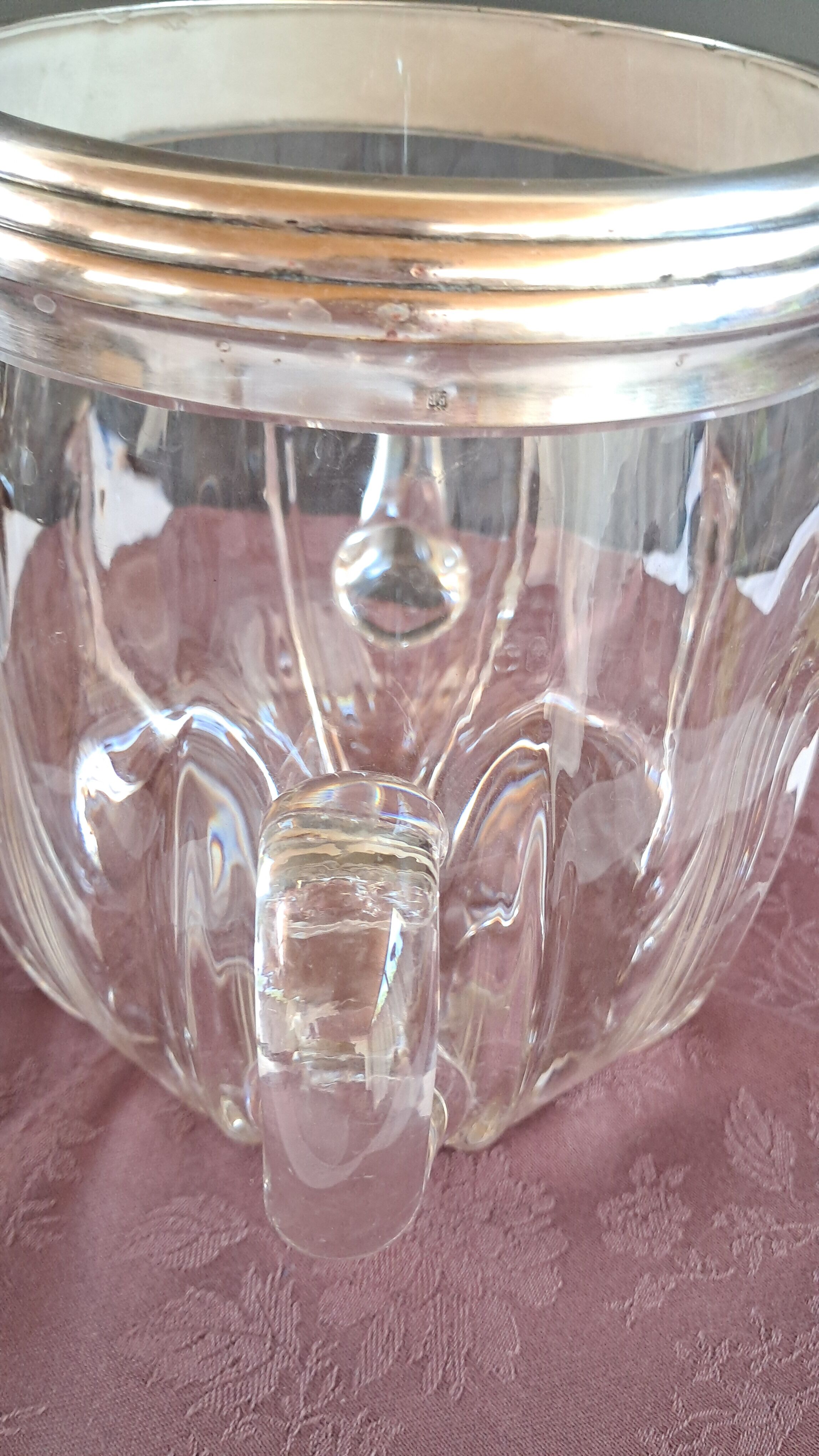 Twisted moulded glass bistro champagne bucket with a silver metal collar.