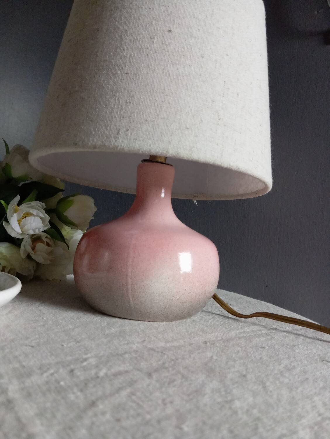 Signed speckled pink ceramic bedside lamp, linen lampshade