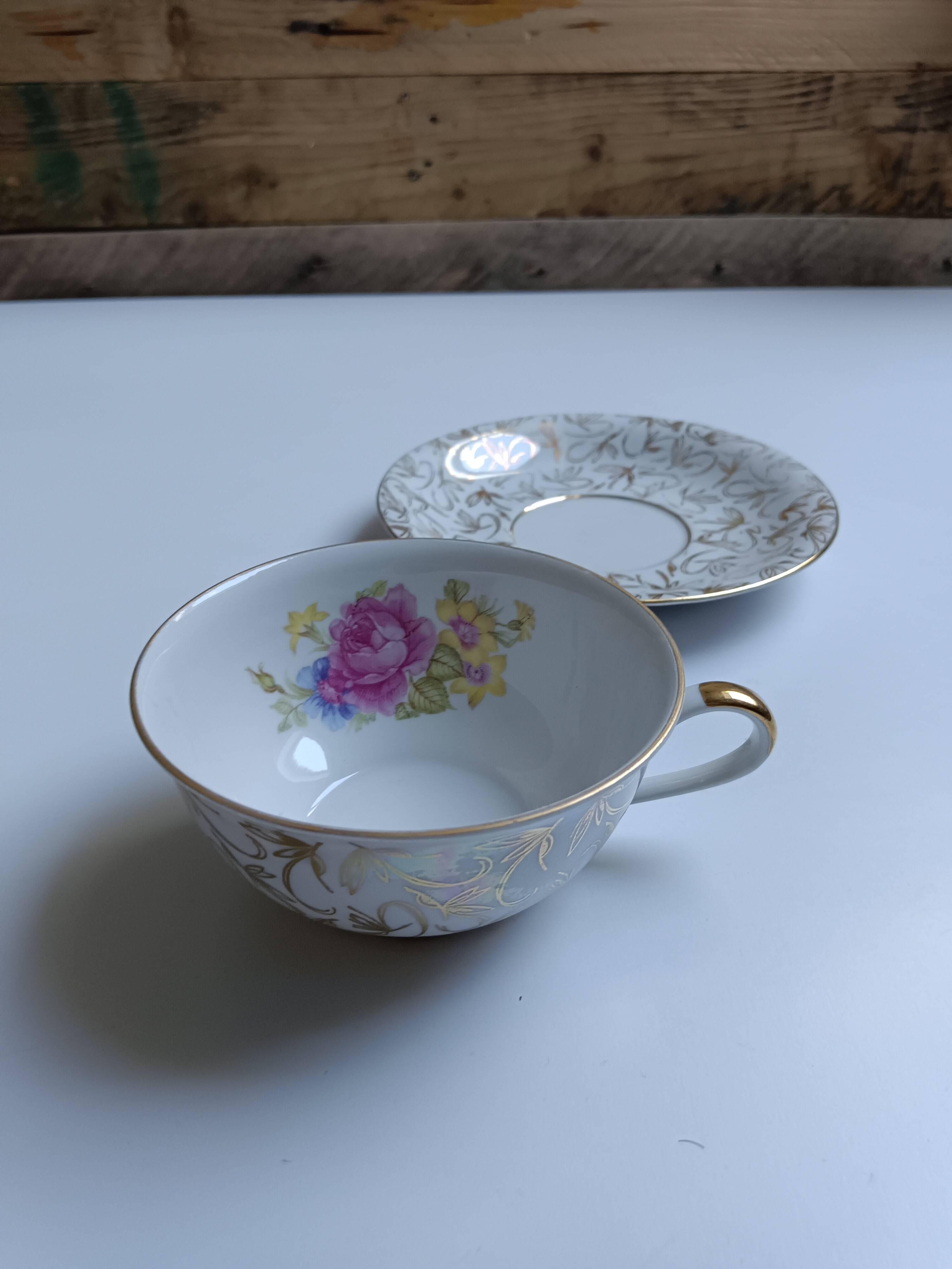 Large porcelain cup from Bavaria with a pearlescent finish and rose decorations.