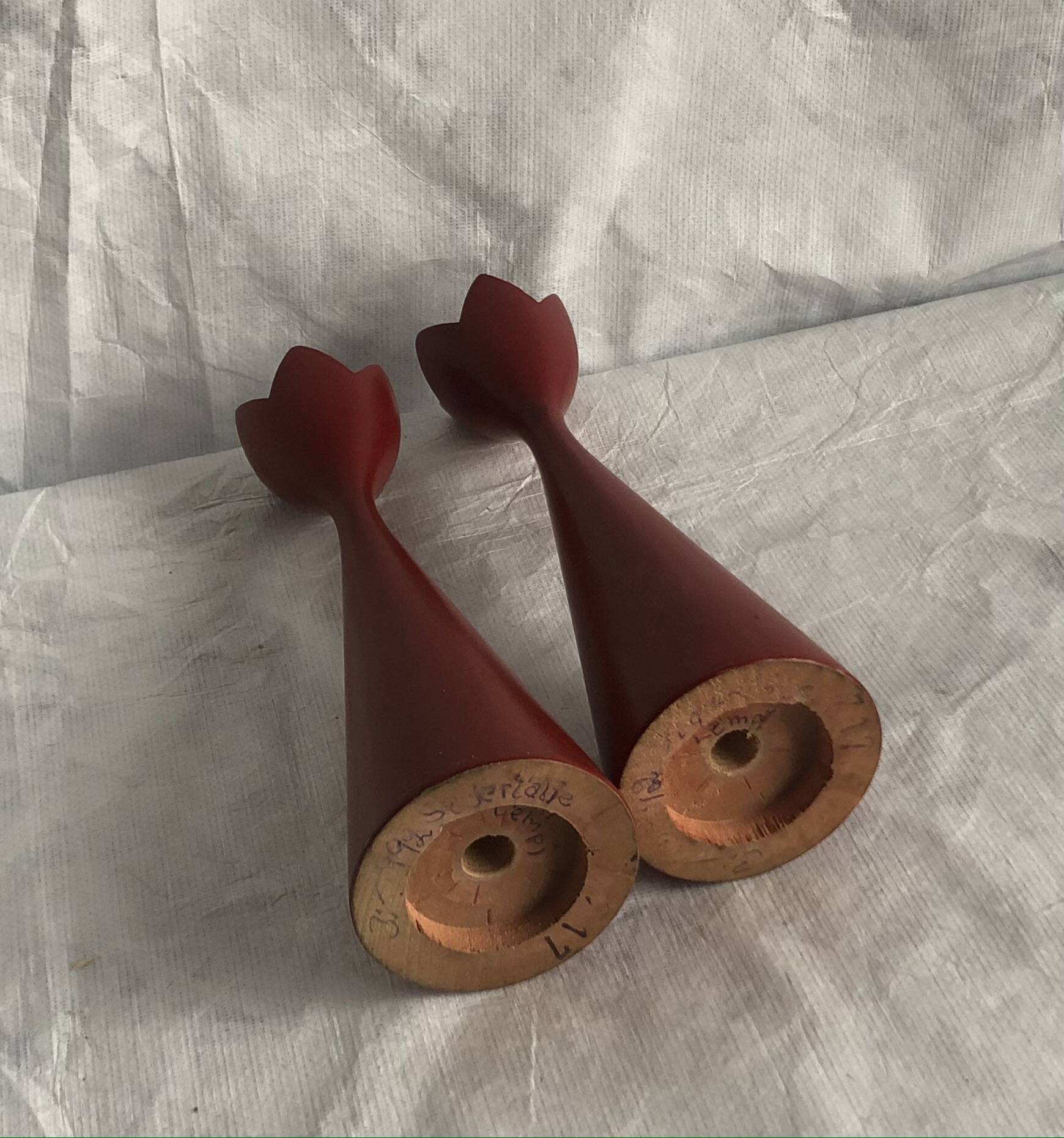 pair of Scandinavian painted wooden candle holders, minimalist atmosphere, free form