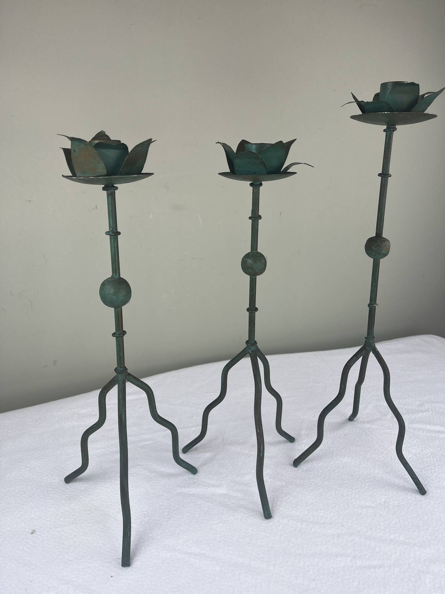 Sculptural candle holder trio