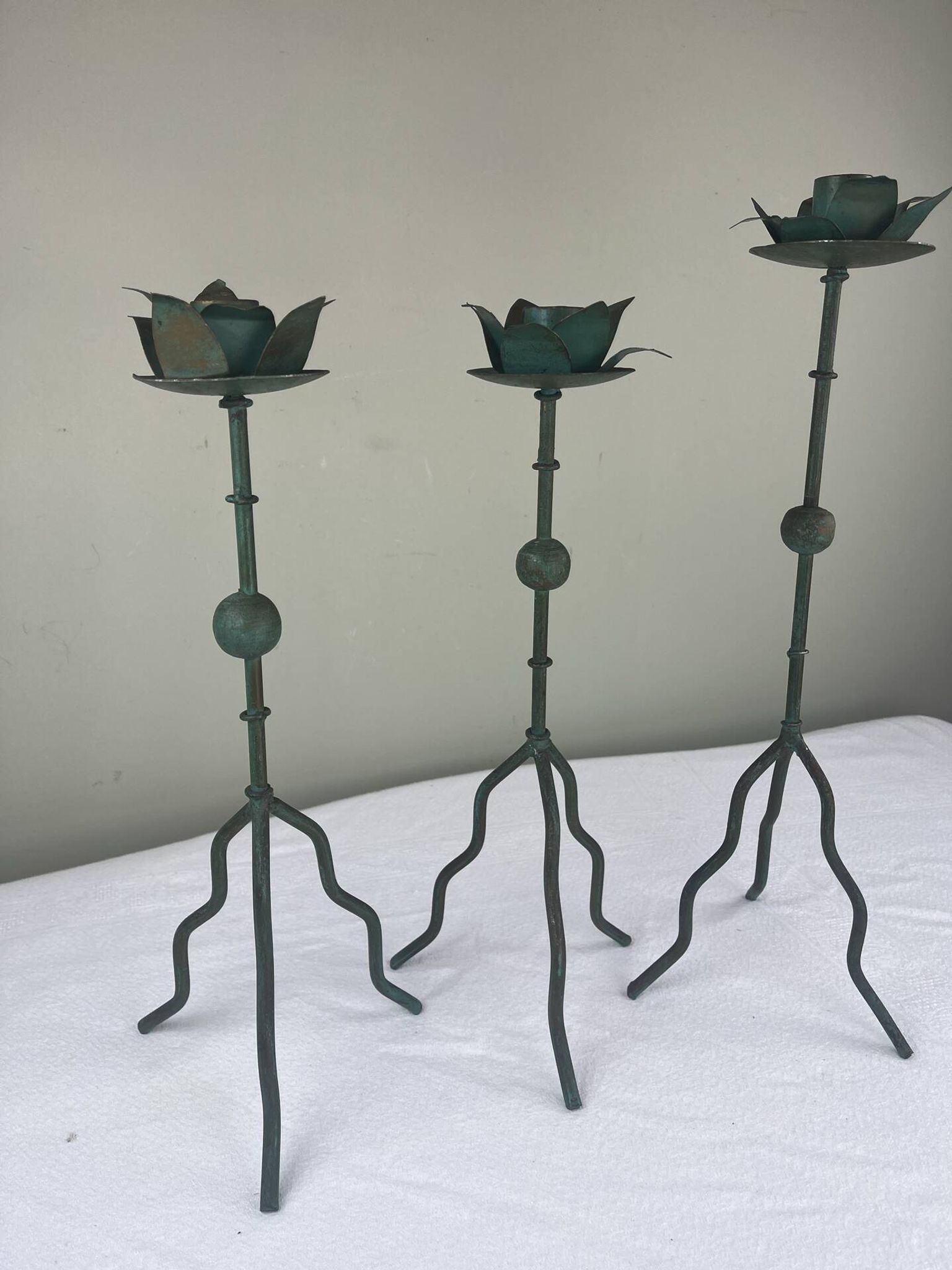 Sculptural candle holder trio