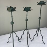 Sculptural candle holder trio