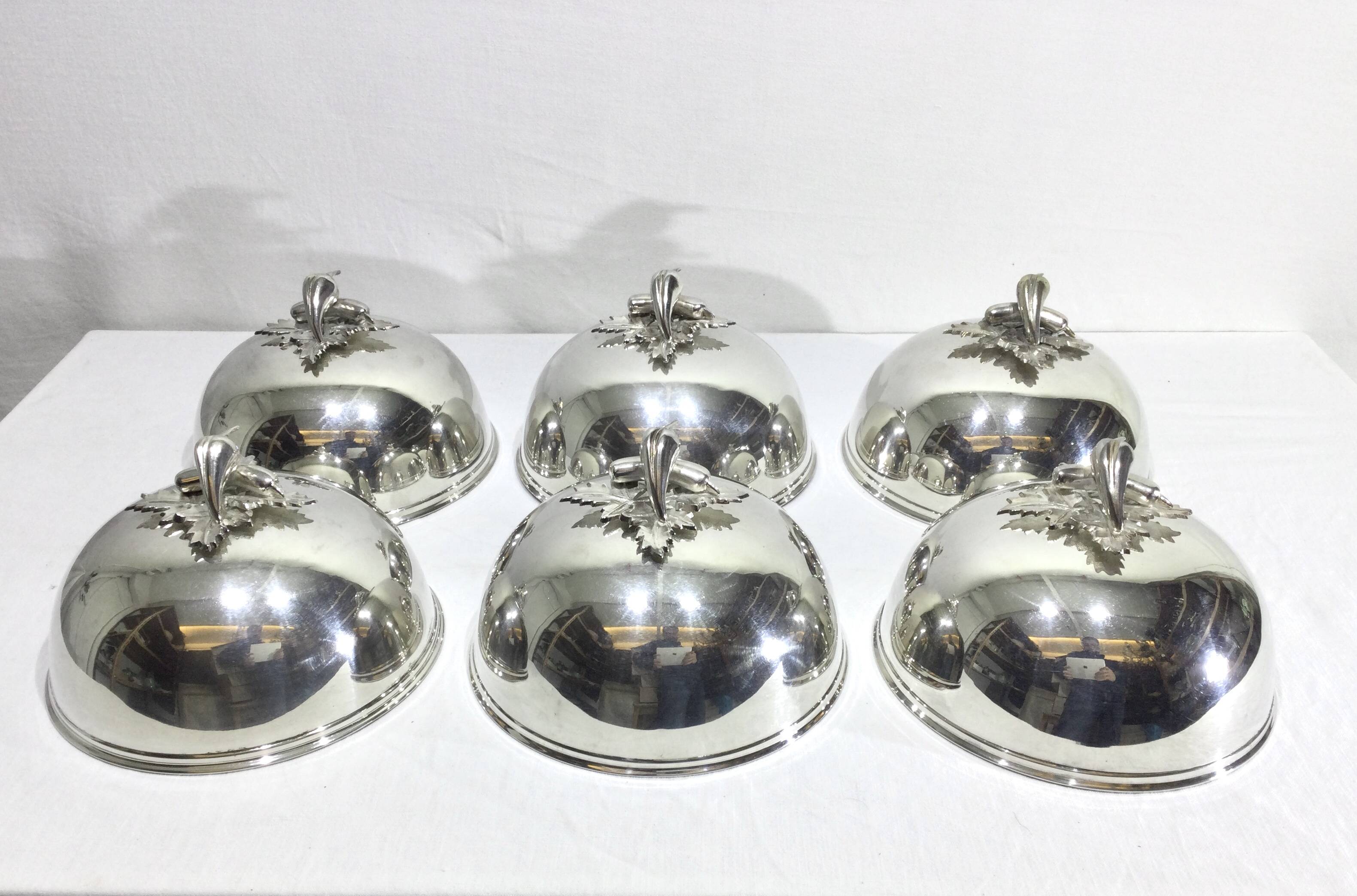 Set of silver-plated serving dishes and bells