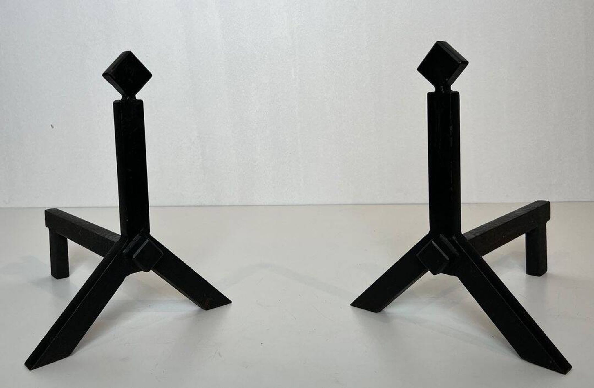 Pair of Modernist Black Iron Andirons with Diamond Finials and Angled Bases