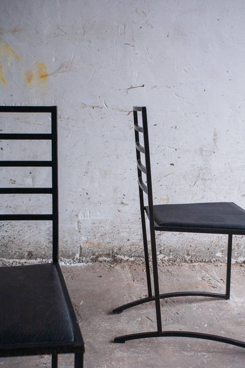 Set of 4 Black Steel Dining Chairs with Black Faux-Leather Seats — Minimalist Geometric Design