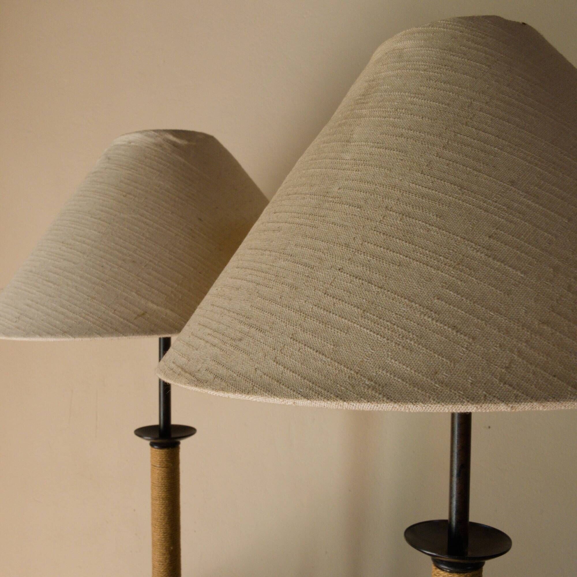 Pair of wrought iron and rope table lamps, adjustable lampshade.