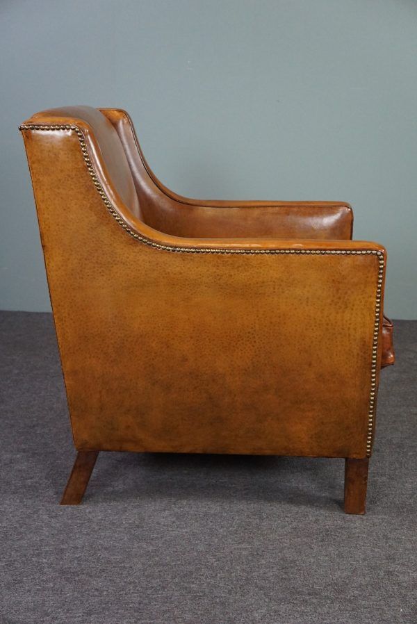 Modern charming armchair in sheepskin