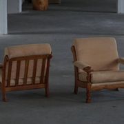 Mid-20th century, pair of armchairs by Henning Kjærnulf, oak and alcantara, 1960s.