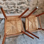 Set of 4 mid-century Italian dining chairs with woven seats, circa 1950–1970.