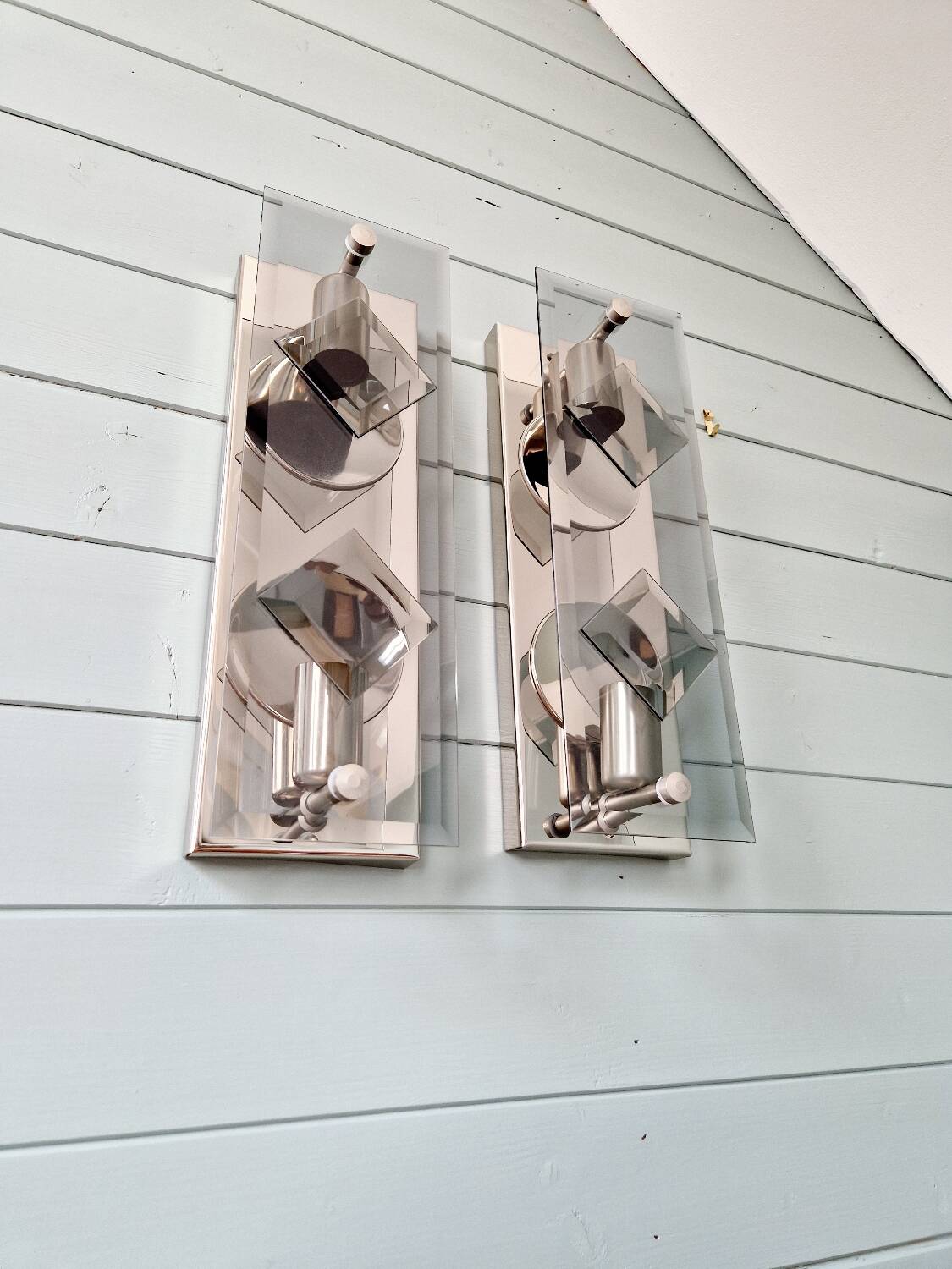 Pair of chrome metal and smoked glass wall sconces, 1970s.