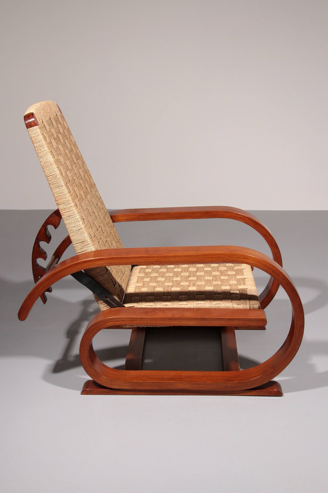 An exceptionally rare mahogany recliner crafted in Italy during the 1950s"