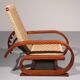 An exceptionally rare mahogany recliner crafted in Italy during the 1950s"