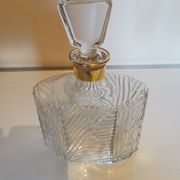 Cut glass carafe with a gold band on the neck.