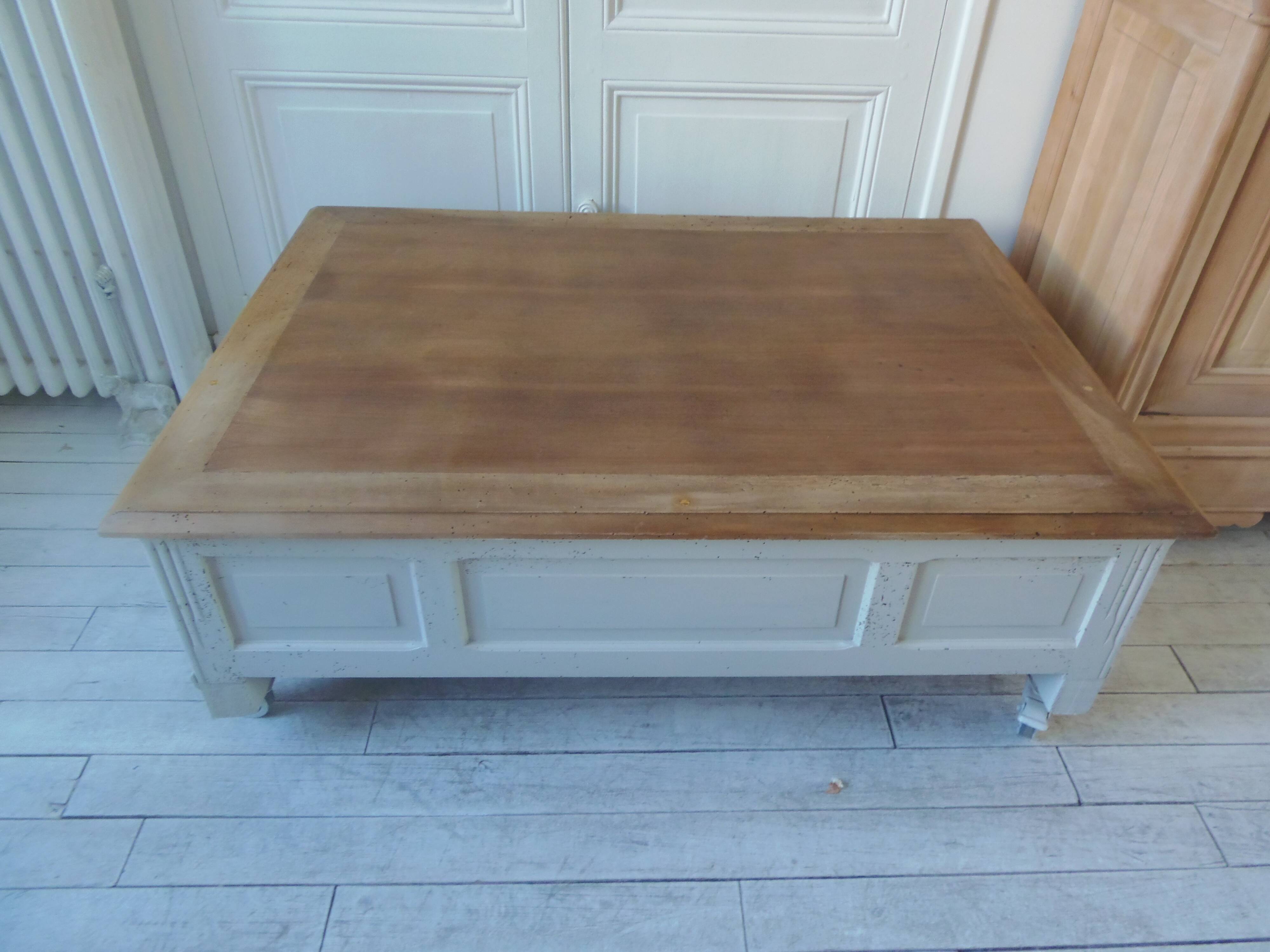Coffee table on casters, made from an old desk, pearl gray base and belt.