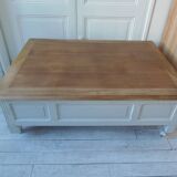 Coffee table on casters, made from an old desk, pearl gray base and belt.