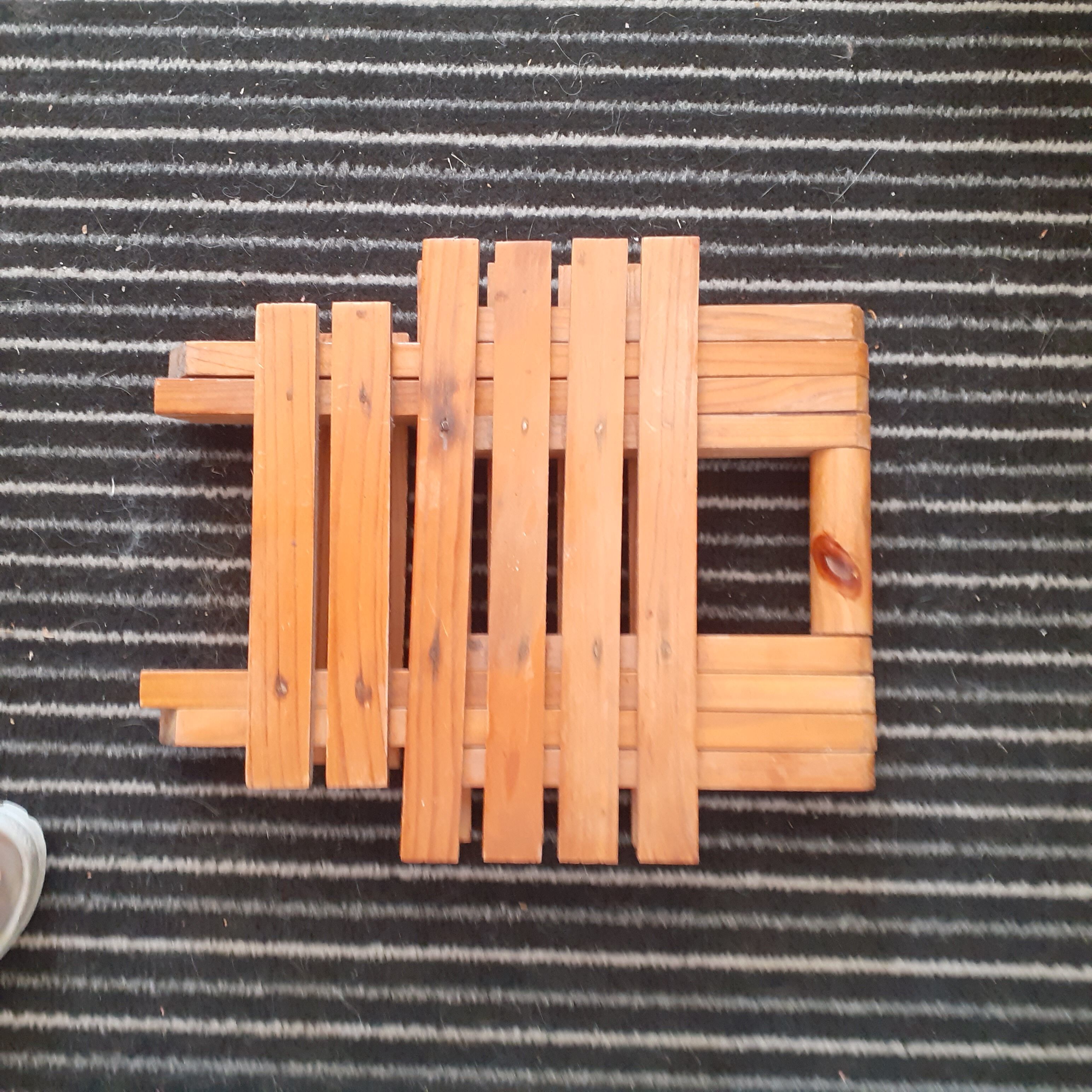 Wooden foldable square stool.