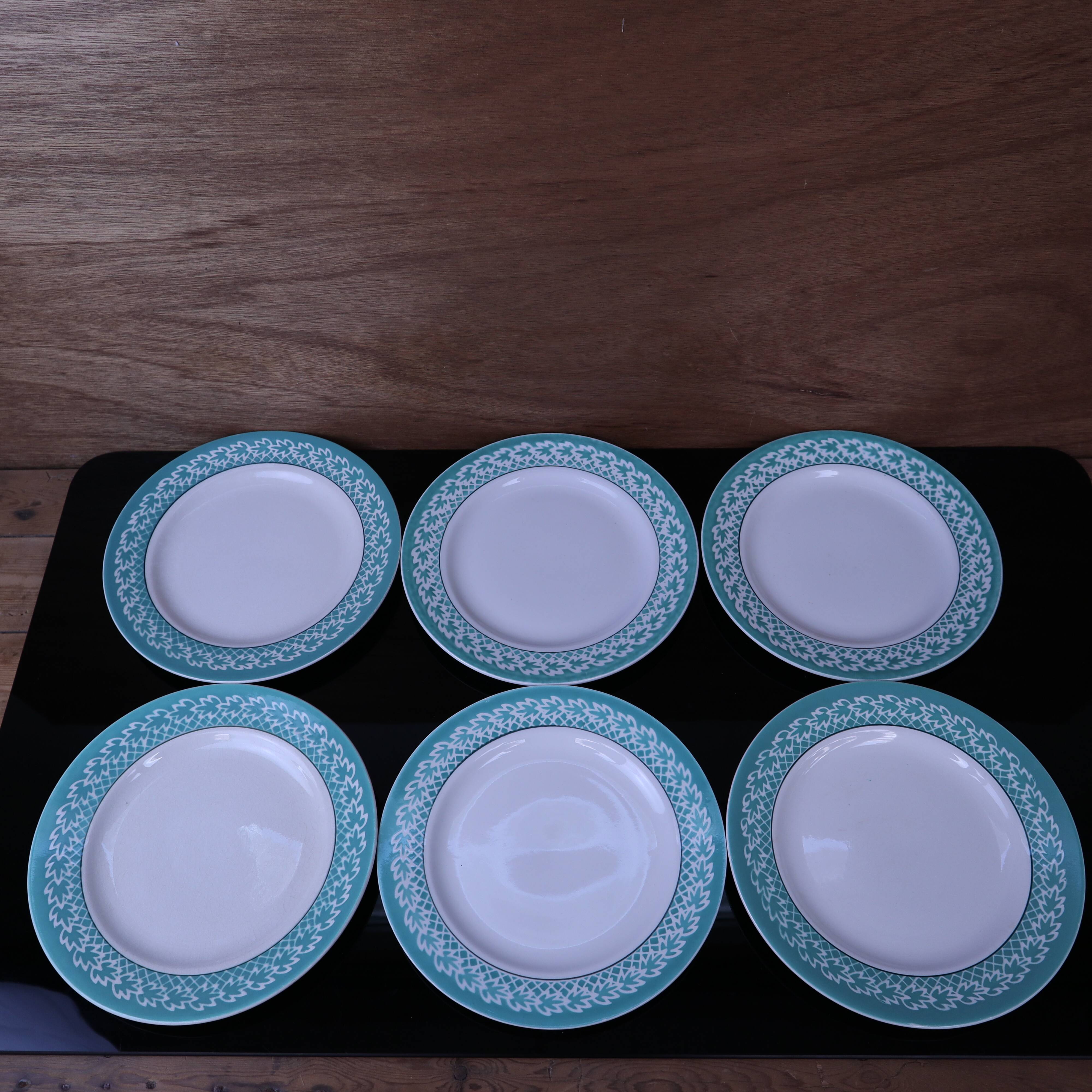 Set of 6 KIFO L'Amandinoise flat plates with green leaf design.