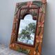 Miroir en bois, sculpté à décor de fleurs