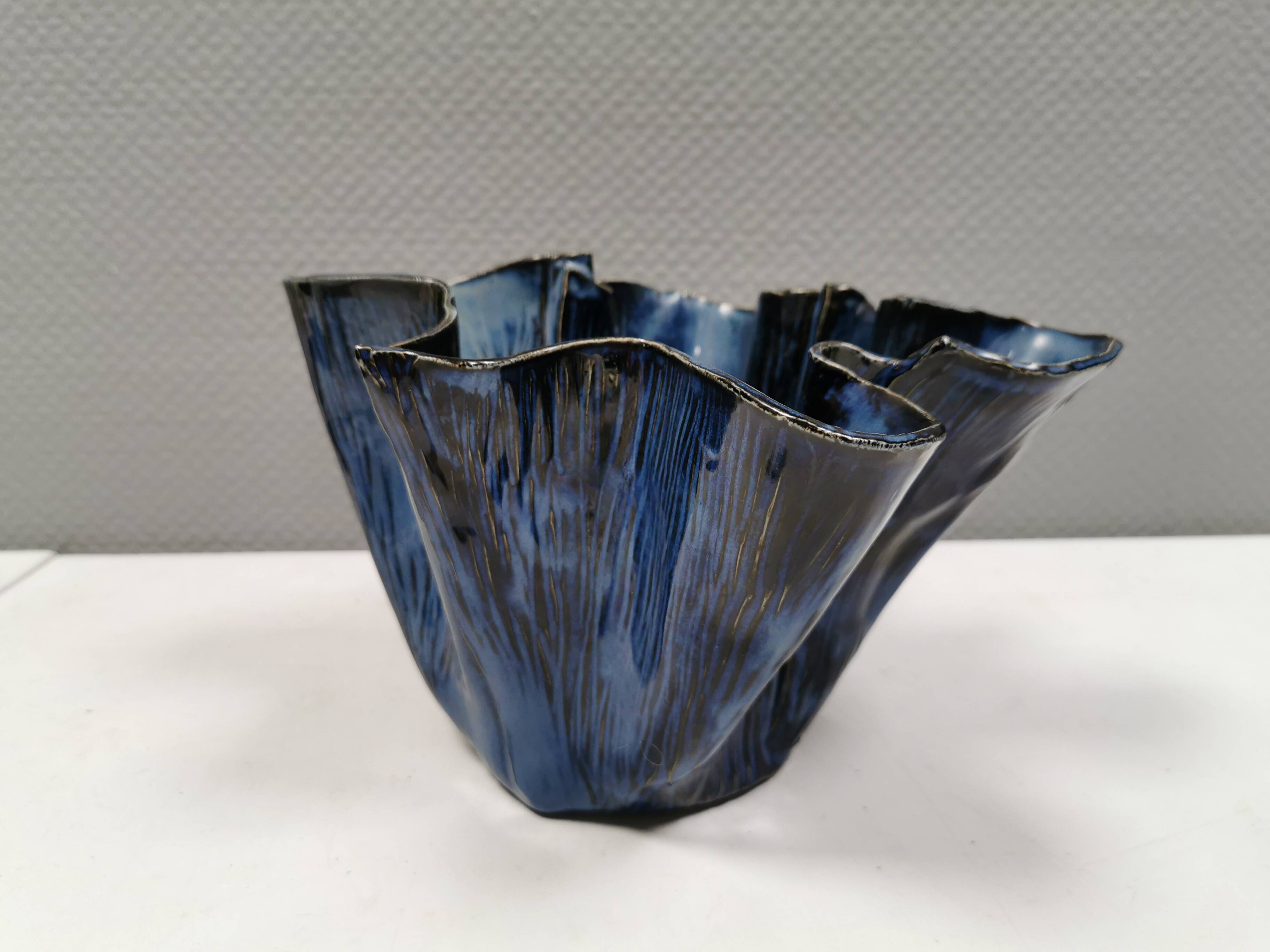 Very special vase in “folded” bluish glazed clay.