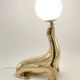 Vintage brass sea lion lamp