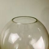 A modernist vase in clear glass.