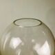 A modernist vase in clear glass.