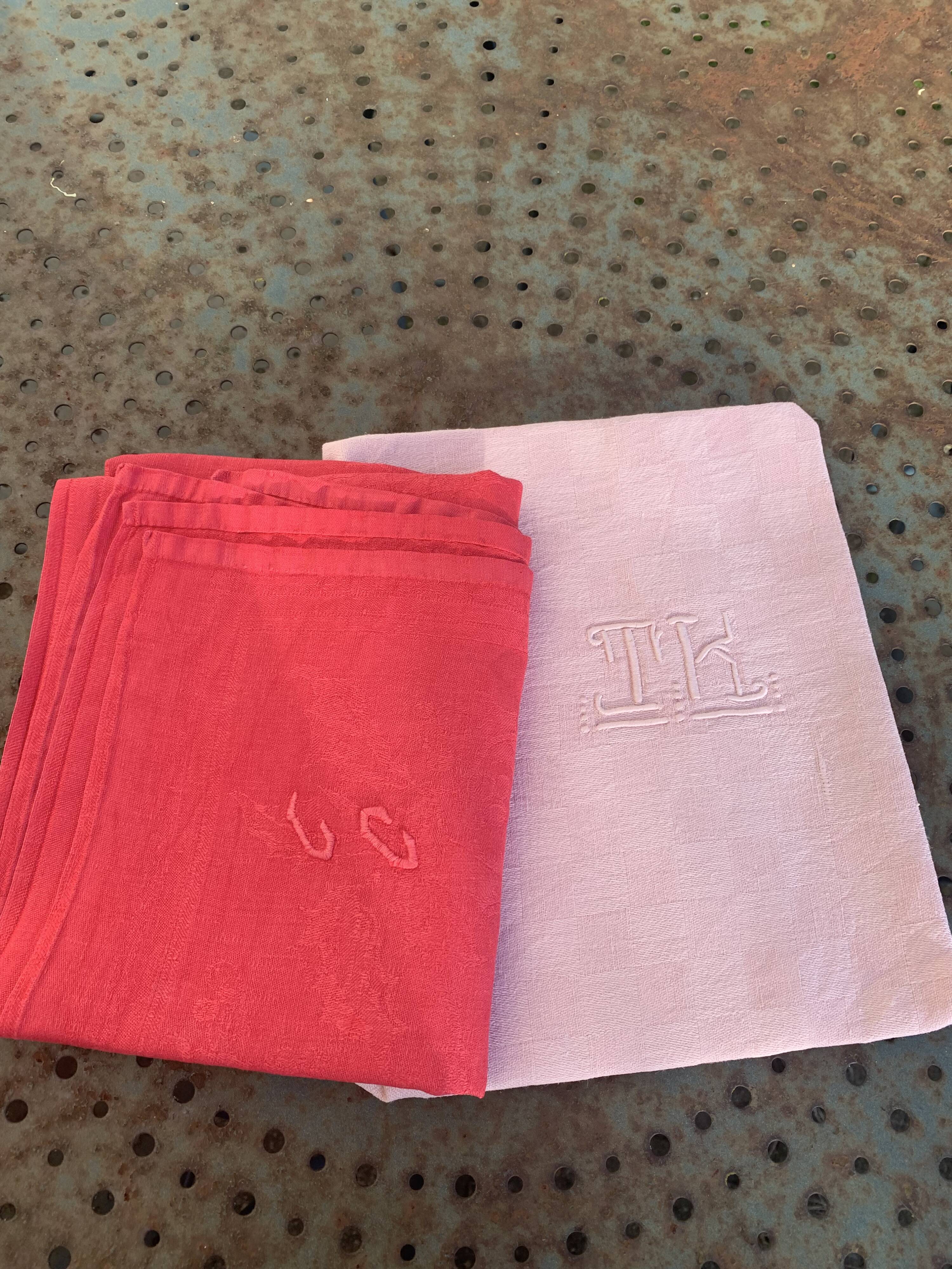 Duo set, consisting of two large pink-dyed cotton and linen towels, embroidered, TK monograms