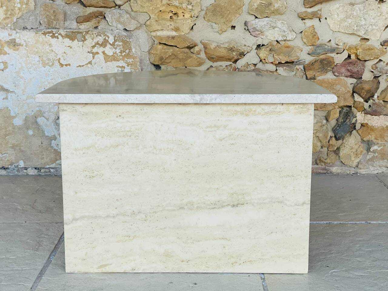 Vintage side table in travertine, circa 1980s.