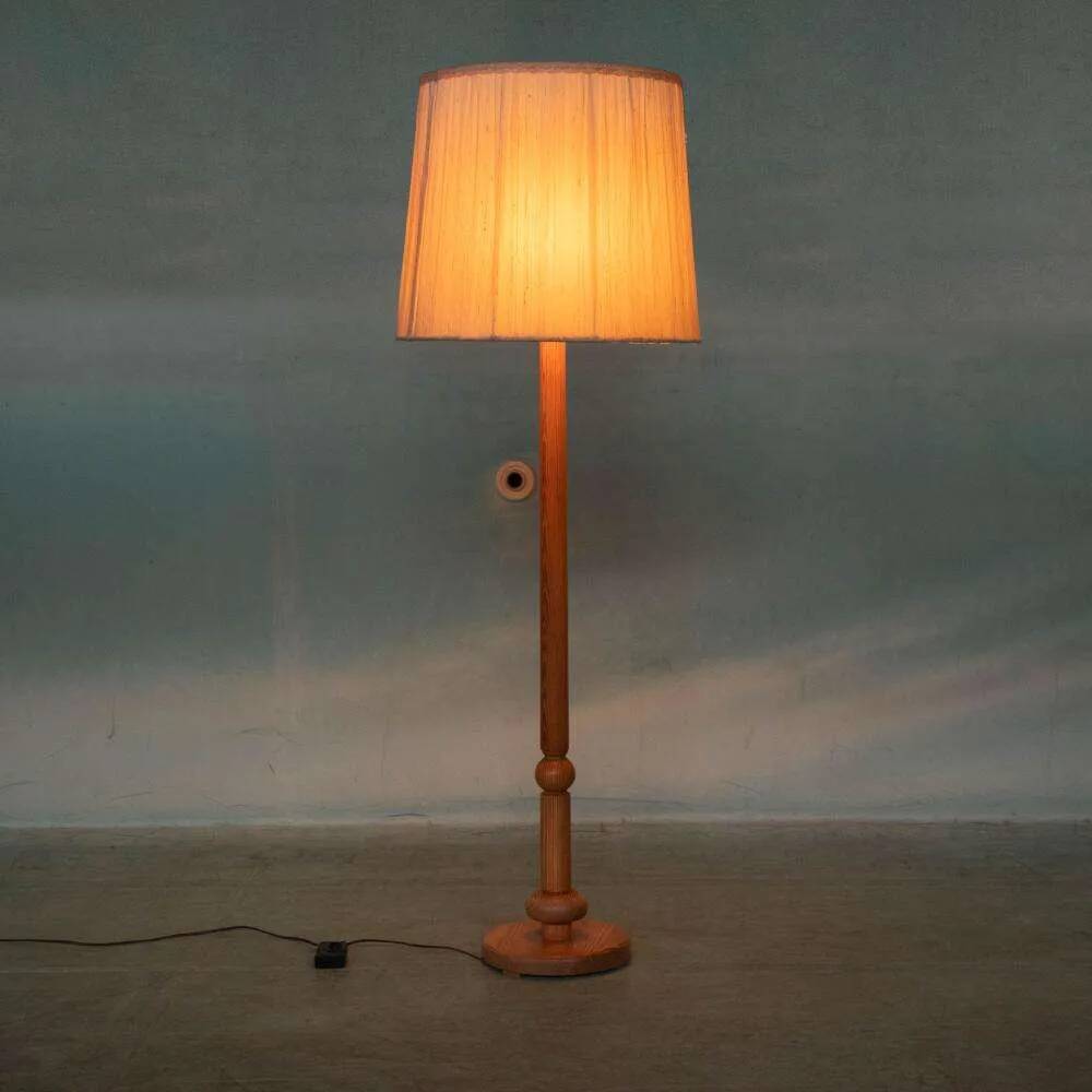 Vintage Swedish wooden floor lamp with pleated shade from the 1960s.