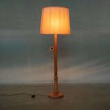 Vintage Swedish wooden floor lamp with pleated shade from the 1960s.