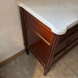 Louis XVI style commode with a shaped marble top.