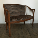 Old wooden and velvet bench