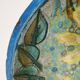 Hollow cut in blue enamelled sandstone decorated with yellow flowers